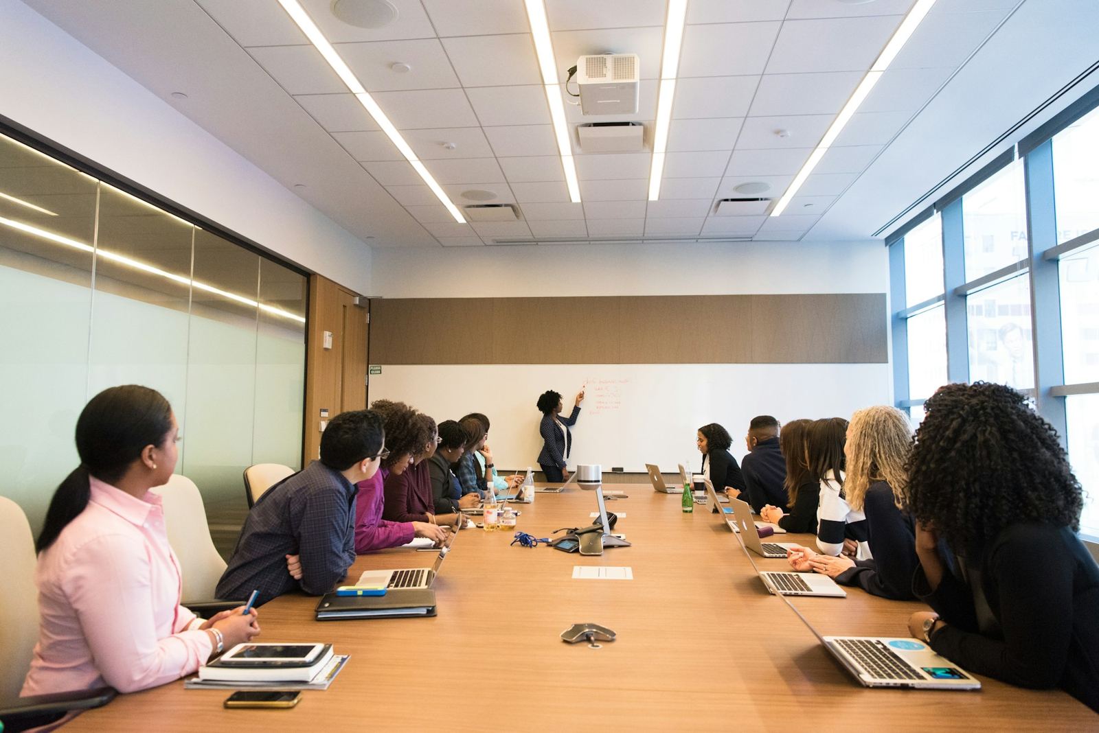 Meeting around a conference table in a light, modern office